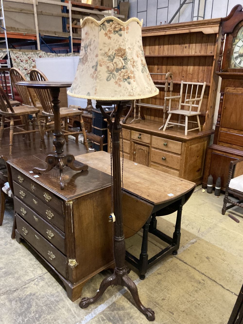 A Victorian mahogany tripod wine table, diameter 50cm height 70cm, together with a carved standard lamp